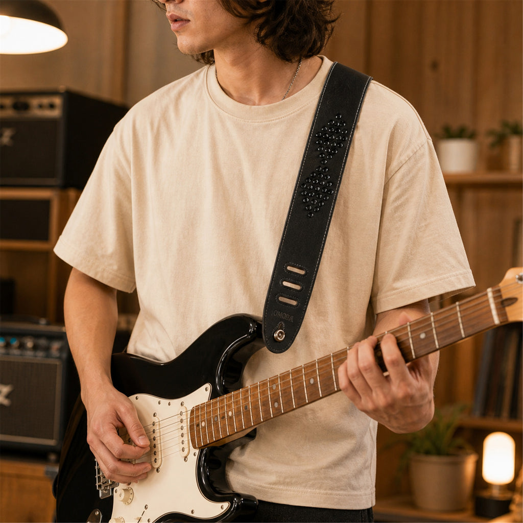 OMORA Studline Strap in a warm music lifestyle setting.