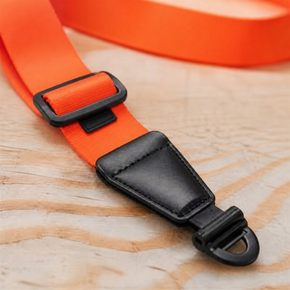 Close view of OMORA Lockstep Strap — Signal Orange.