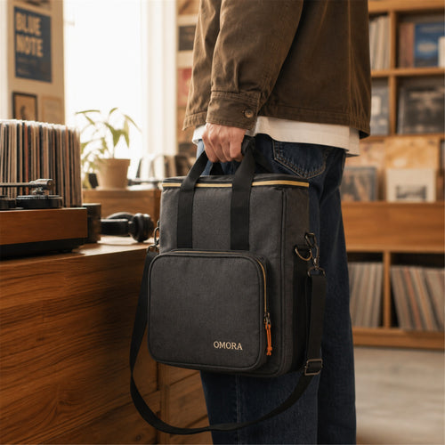 OMORA Compact Vinyl Carry Bag in a warm music lifestyle setting.